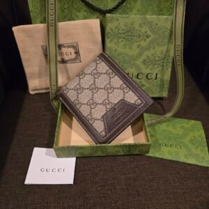 Gucci cartera lona GG Supreme con ribete de piel café