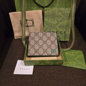 Gucci cartera lona GG Supreme con emblema turquesa