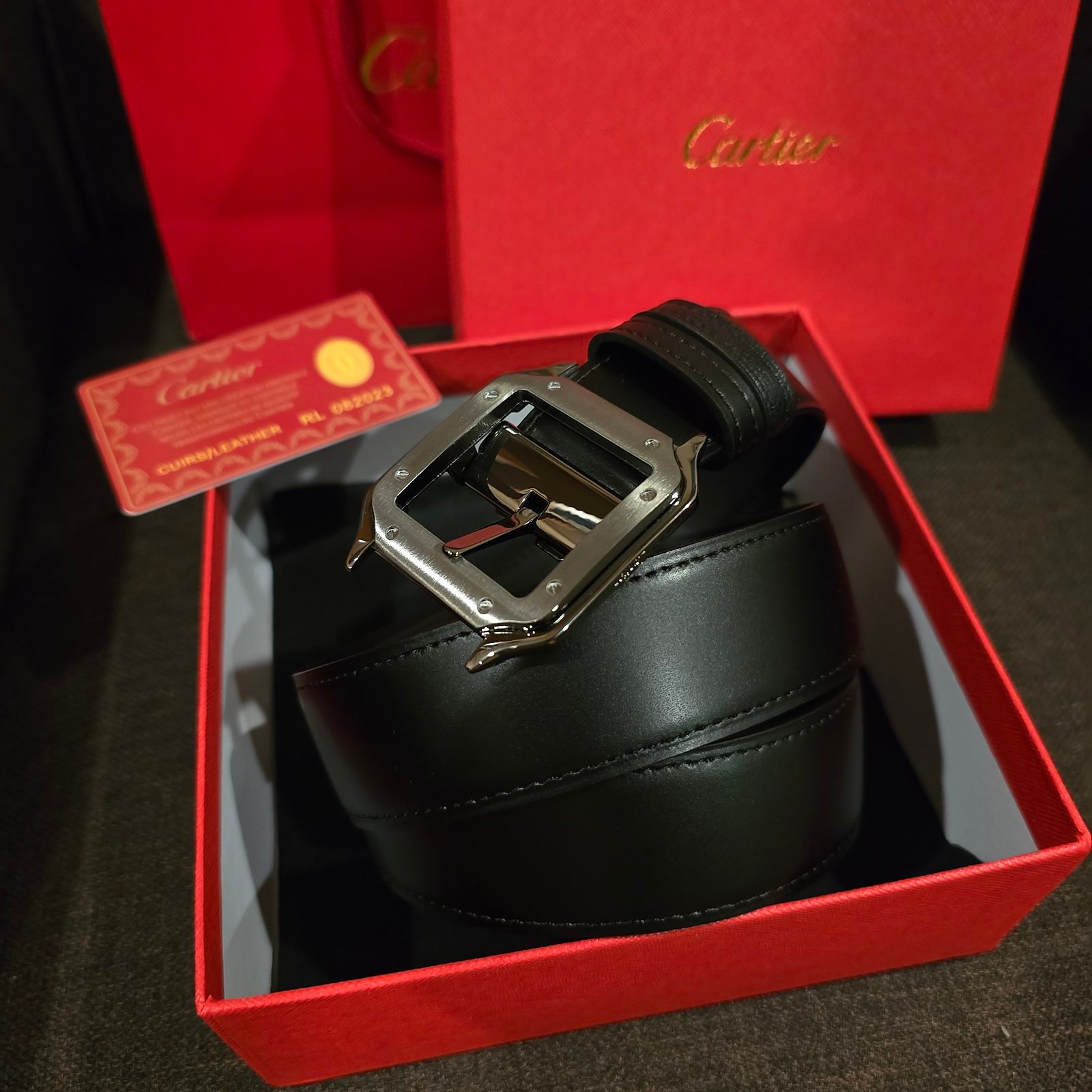 Cartier cinturón Santos reversible negro en dos texturas hebilla gunmetal