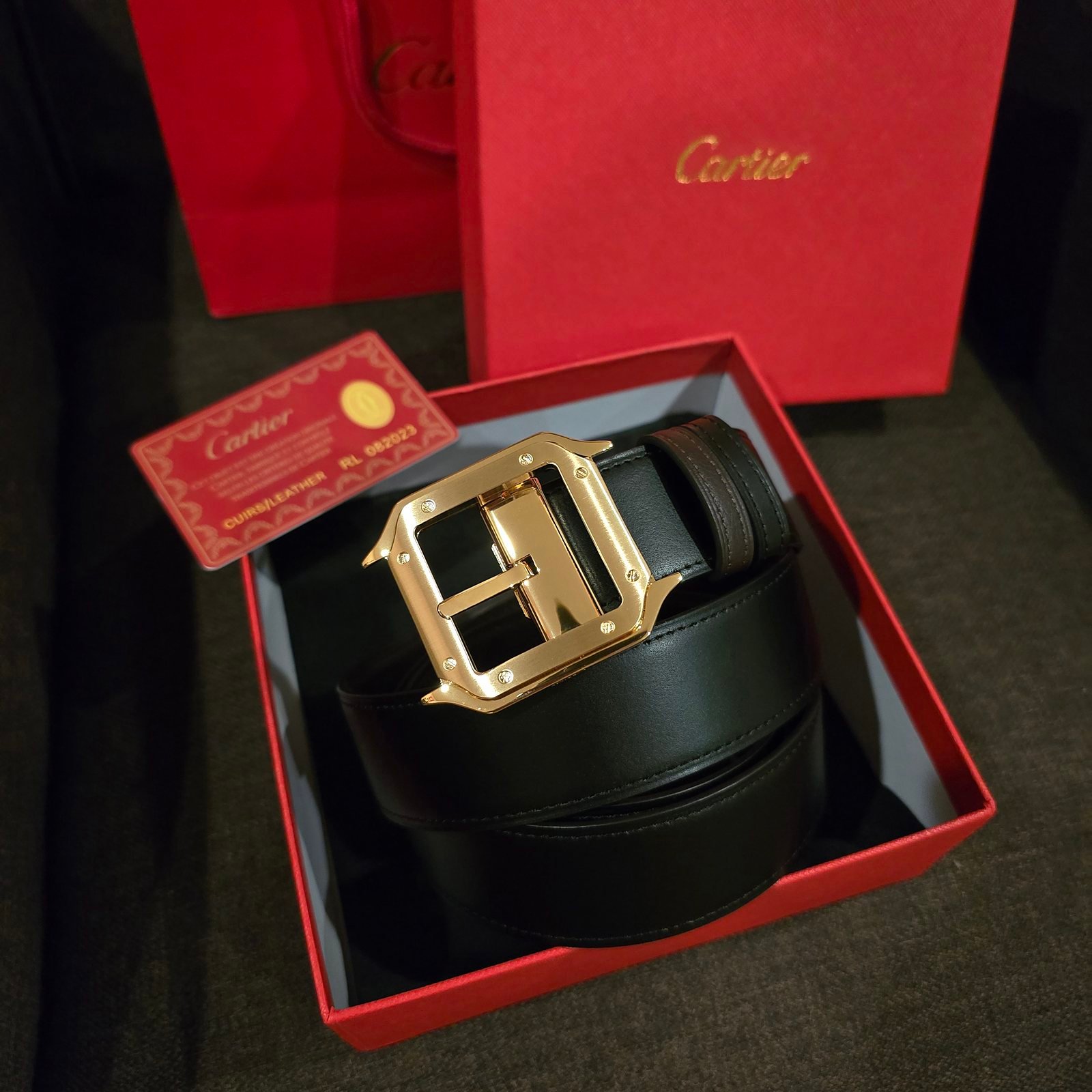 Cartier cinturón Santos reversible negro y café hebilla dorada