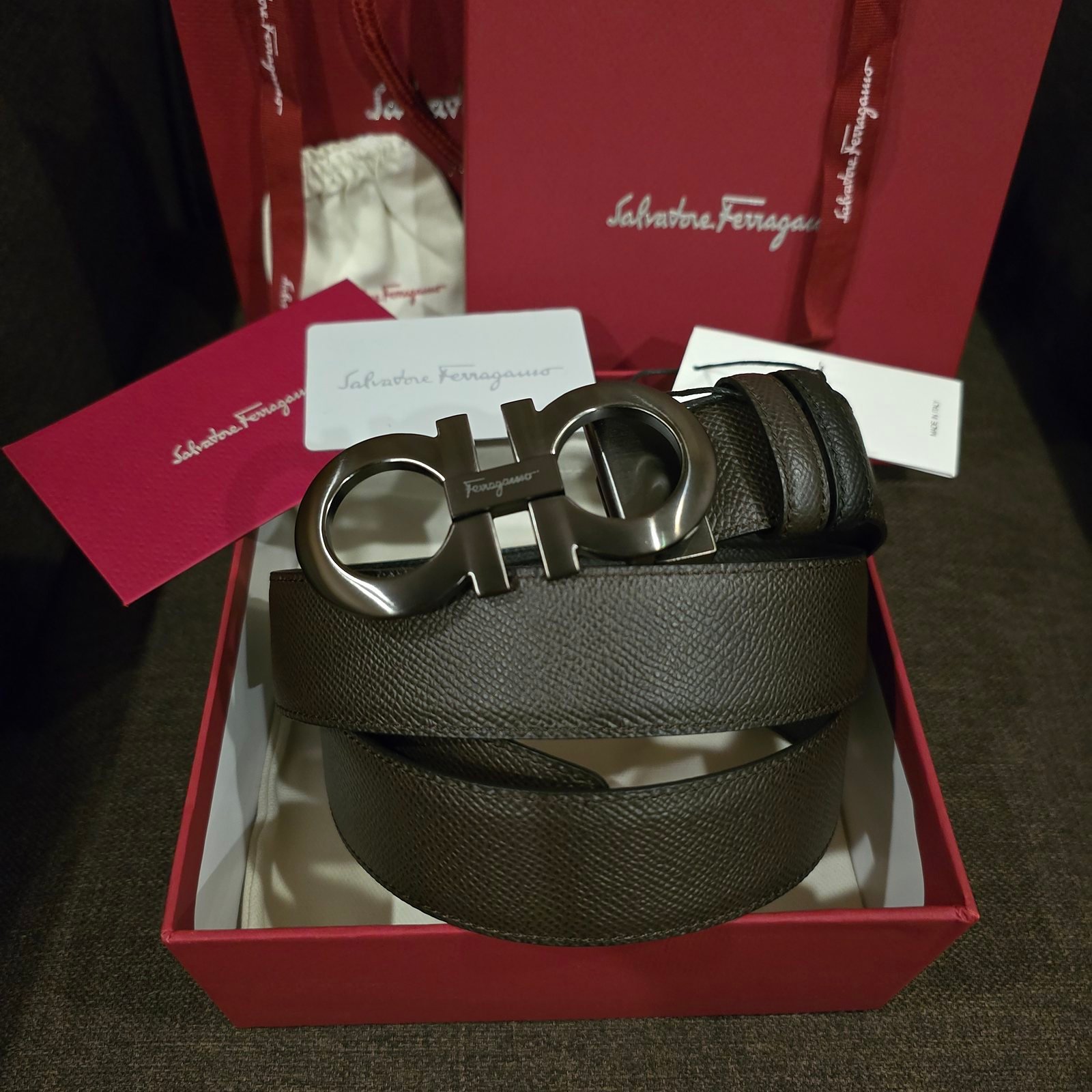 Ferragamo cinturón reversible piel lisa negra hebilla Gancini plateada intercambiable