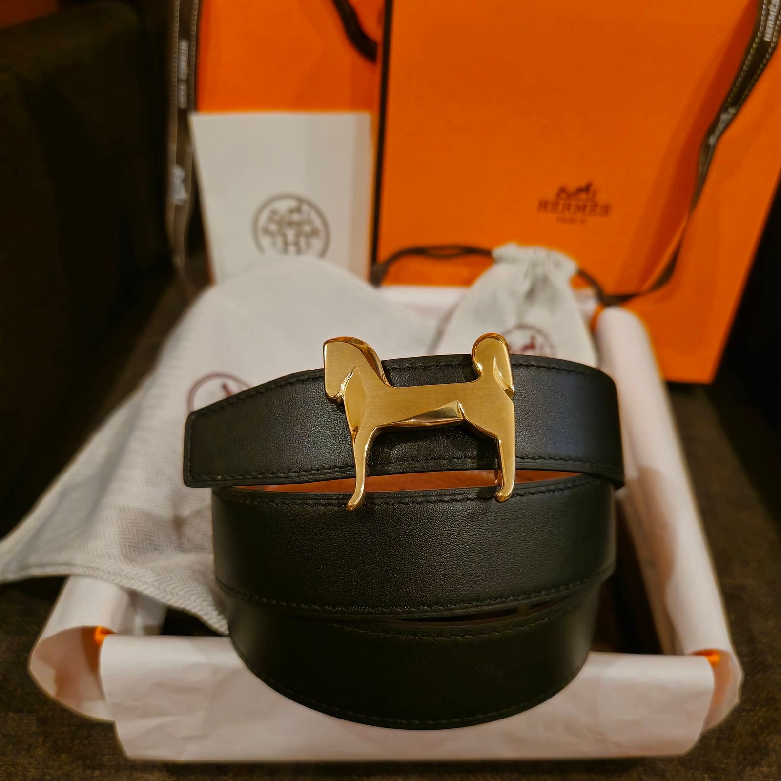 Hermès cinturón reversible piel lisa negra y naranja hebilla Panache dorada